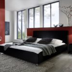SAM® Polsterbett 120x200 cm Zarah, schwarz, pflegeleichtes Design-Bett mit Kunstlederbezug, abgestepptes Kopfteil